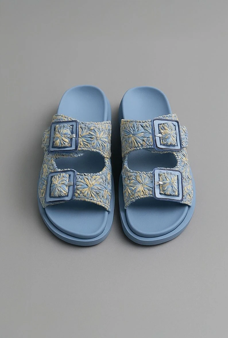 WhatsApp Image 2025-06-29 at 18.48.29_726e4223 Woven Slide with Floral Pattern and Gold Buckles – Baby blue